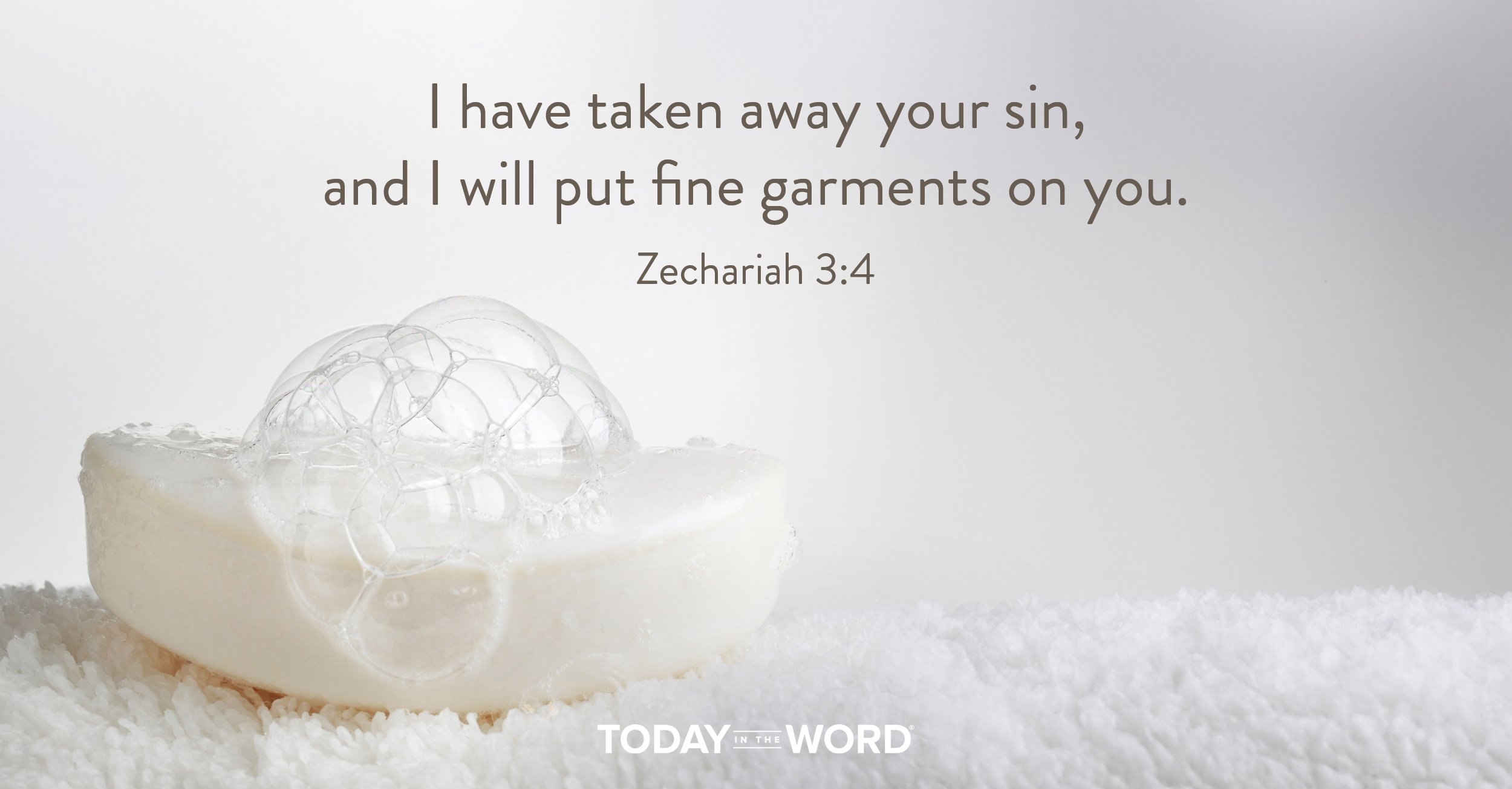 Today's daily devotional Bible verse: Zechariah 3:4 I have taken away your sin, and I will put fine garments on you. | A sudsy bar of white soap on a white washcloth